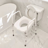 Toilet aid with handrails placed over a toilet next to a bathtub and tiled floor, side view.