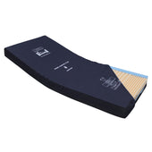 Prime Comfort Plus Mattress with navy cover and exposed yellow foam, side view.