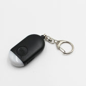 Lifemax Rechargeable Personal Alarm keychain with torch and metal ring on a plain white background, front view.