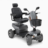 Drive Safari Scooter with padded seat, armrests, basket, mirrors, four wheels and suspension, front angle view.