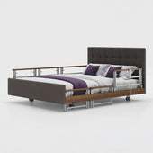 Opera Beds Signature Comfort Plus Dual Profiling Bed with drop side rails, leatherette upholstery and pillows, side view.