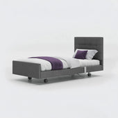 Opera Beds Signature Comfort Profiling Bed with white bedding and purple accents on a plain background, front view.