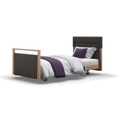 Opera Beds Signature Upholstered Profiling Bed with white bedding, purple throw and two pillows, front view.