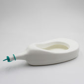 Homecraft Slipper Urinal with cap on its side against a plain white background, side view.