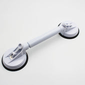 Small adjustable suction cup grab bar for bathroom or shower support, shown attached to smooth surface, side view.