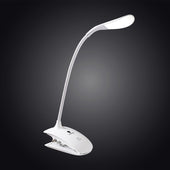 The Daylight Company Smart Clip-On Lamp with flexible LED arm illuminated against a dark gradient background, front view.