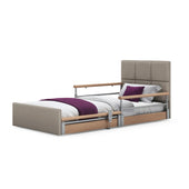 Solo Comfort Plus Profiling Floor Bed with wooden rails and supportive bedding, linen fabric upholstery, front angle view.