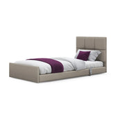 Solo Comfort Profiling Floor Bed with white bedding, purple accent pillows and blanket, front view.