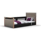 Solo SafeSide upholstered profiling floor bed with headboard, wood frame, safety rail and purple accents, front view.