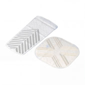 Two textured silicone bath and shower mats with geometric patterns, one rectangular and one square, top view.