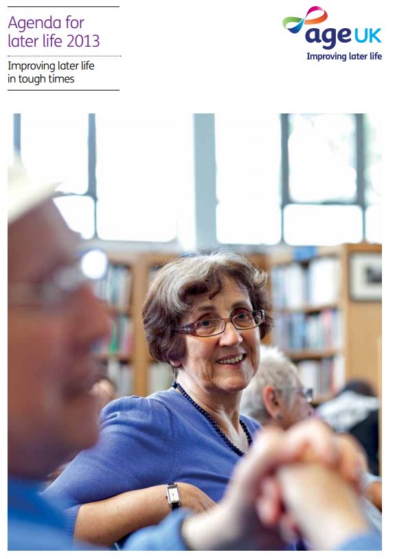 An older woman with glasses smiles in a library, surrounded by others, highlighting positive aspects of aging in the 2013 publication.