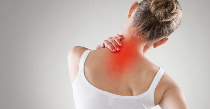 A woman touches her neck with one hand, showing discomfort. Her neck area is highlighted in red against a gray background.