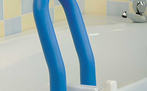 Blue safety bars attached to the edge of a white bathtub. The background features light blue and pale yellow tiles with a silver faucet.