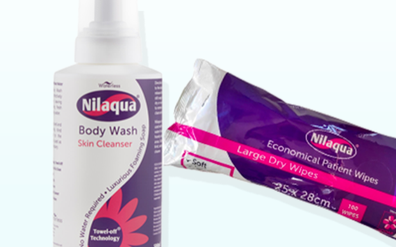 A bottle of body wash labeled Towel-off Technology and a pack of large dry wipes, both in purple and white packaging.