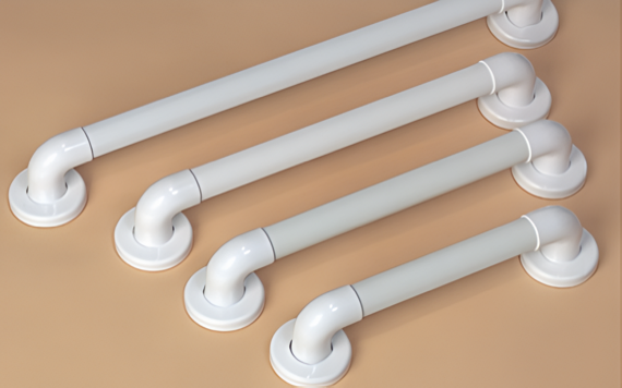 Four white grab bars are mounted on a beige wall, parallel and horizontal, gradually increasing in length from top to bottom.