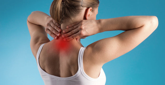 A woman in a white tank top faces away, holding her neck. Red marks on her neck suggest pain. The background is light blue.