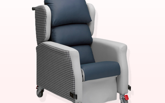 A comfy lounge chair with dark seat cushions, light houndstooth-patterned sides, and wheels for easy movement.