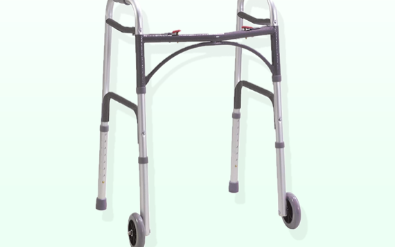 A lightweight, silver walker with front wheels and padded grips for mobility support against a light background.