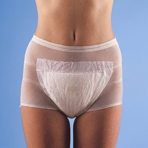 Able2 Stretch Pants Short Leg Length pack of 5, white mesh underwear shown on person, blue background, front view.