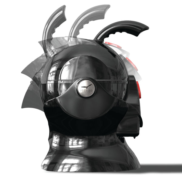 Black Uccello Designs kettle tilted to show ergonomic handle and red buttons on white background, side view.