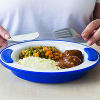 ORNAMIN Keep Warm Plate with mashed potatoes, peas with carrots and meatballs in sauce, person holding fork and knife, in use view.