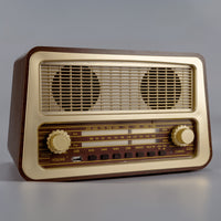 Ravencourt One Button Radio with two speakers, gold accents and simple dials in a vintage style, shown front view on a neutral background.