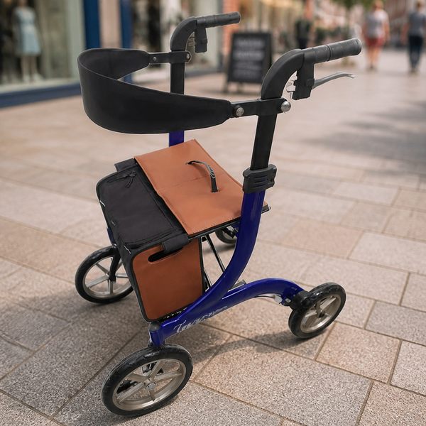 Integrity Taurus Premium Rollator with a brown bag on a city pavement, front view.