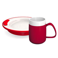 Red double wall mug and matching plate with raised rim, shown together, front view.