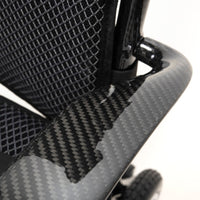 Lightweight carbon fibre armrest and mesh backrest on Drive AeroCarbon Powerchair, close-up.