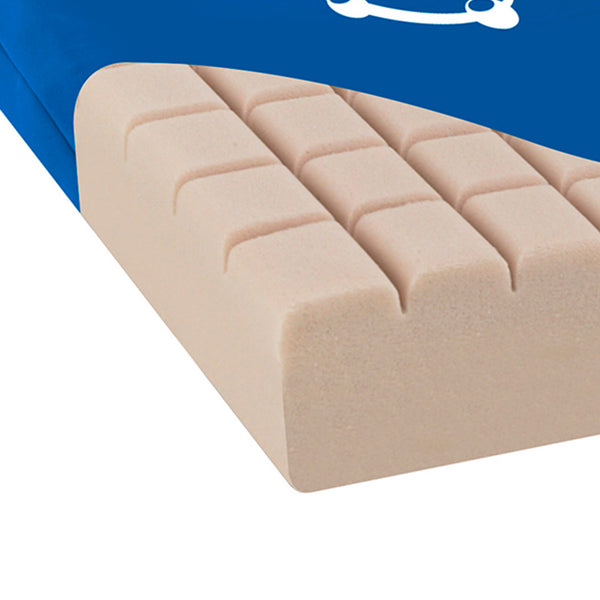 Apollo Classic Med Cushion with grooves, partly covered by blue fabric for pressure care, close-up.