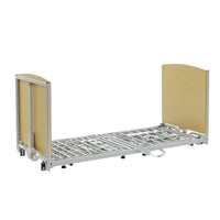 Apollo Super Low Bed with light wood head and footboards, low height for fall risk, no mattress, side view.