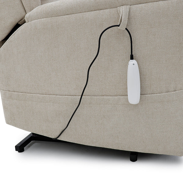 Beige dual motor riser recliner with black cord and white remote on the side, front view.
