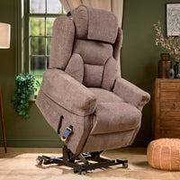 Motion Healthcare Monterey Royale Five Motor Wide Riser Recliner Chair slightly reclined in a room with green walls, front angle.