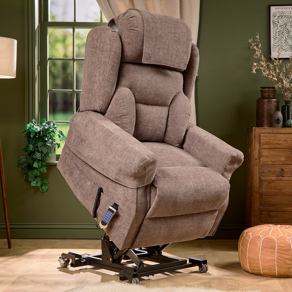 Motion Healthcare Monterey Royale Five Motor Wide Riser Recliner Chair slightly reclined in a room with green walls, front angle.