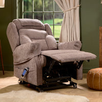 Motion Healthcare Monterey Royale Five Motor Riser Recliner Chair with extended footrest and adjustable headrest, front view.