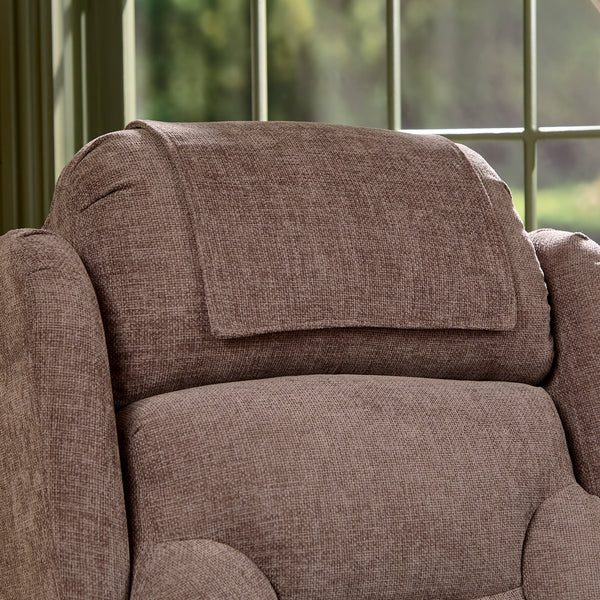 Motion Healthcare Monterey Royale Five Motor Wide Riser Recliner Chair by a window with greenery outside, close-up.