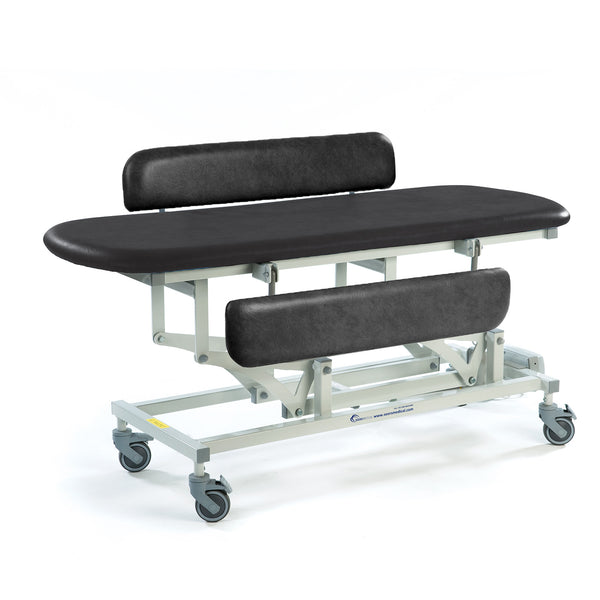 Black height adjustable changing table with padded backrest, side rail and wheeled metal frame, side view.