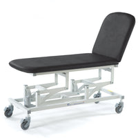 Black SEERS Medical Sterling Electric 2 Section Couch with white metal frame, four castor wheels, adjustable backrest, side view.