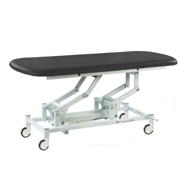 SEERS Medical electric therapy hygiene table with black cushioned top, white frame and wheels, clinic equipment, side view.