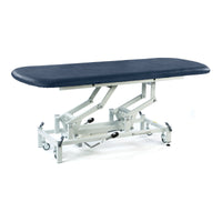 Dark blue SEERS Medical hydraulic therapy hygiene table with height adjustment and wheels, side view.