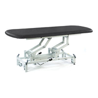 Black electric therapy hygiene table with white metal frame and wheels, height adjustable, side view.