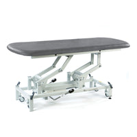 SEERS Medical Electric Therapy Hygiene Table in dark grey with cushioned top and sturdy frame, angled side view.