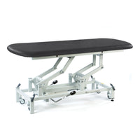 Black SEERS Medical electric therapy table with height adjustment, white wheeled frame, clinical use, side view.