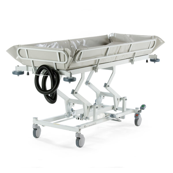 Hydraulic shower trolley with waterproof basin, scissor-lift frame, castors, and electric controls on white background, side view.
