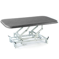 SEERS Medical Electric Therapy Mat Table with height adjustment, sturdy frame and wheels, medical use, side view.
