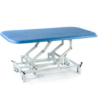 SEERS Medical Electric Therapy Mat Table with height adjustment and sturdy wheeled frame, side view.