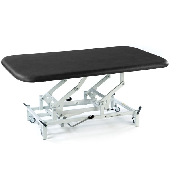 Black hydraulic therapy mat table with adjustable height and wheels, designed for medical or physiotherapy settings, front angle view.