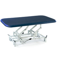 SEERS Medical Hydraulic Therapy Mat Table with metal base and wheels, white background, angled view.