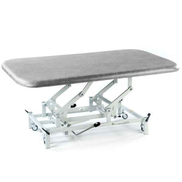SEERS Medical Hydraulic Therapy Mat Table with adjustable padded surface and hydraulic base, suitable for exams or rehab, side view.