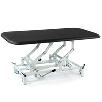 Black SEERS Medical hydraulic therapy mat table with height adjustment, white metal wheeled base, white background, front angle.